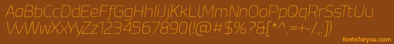 フォントEsphimere Thin Italic – オレンジ色の文字が茶色の背景にあります。