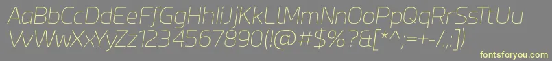 Fonte Esphimere Thin Italic – fontes amarelas em um fundo cinza