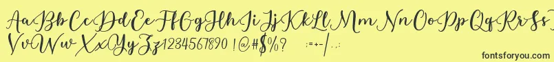 Estafet Letter Script Font – Black Fonts on Yellow Background