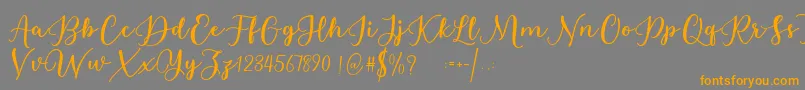 Estafet Letter Script Font – Orange Fonts on Gray Background
