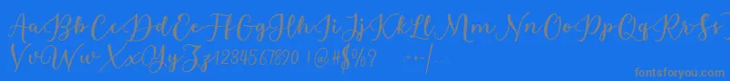 Fonte Estafet Letter Script – fontes cinzas em um fundo azul