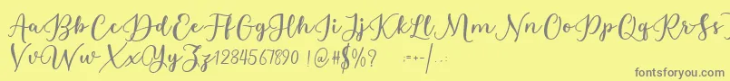 Estafet Letter Script Font – Gray Fonts on Yellow Background