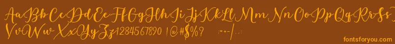Estafet Letter Script Font – Orange Fonts on Brown Background