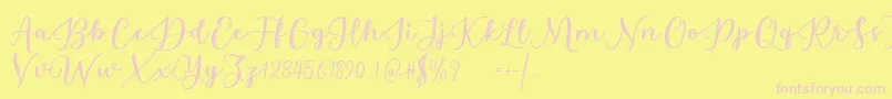 Fonte Estafet Letter Script – fontes rosa em um fundo amarelo