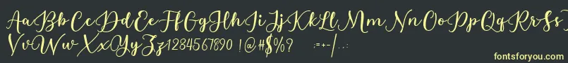 Estafet Letter Script Font – Yellow Fonts on Black Background