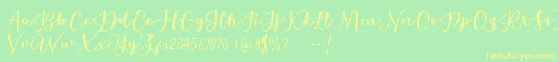 Estafet Letter Script Font – Yellow Fonts on Green Background