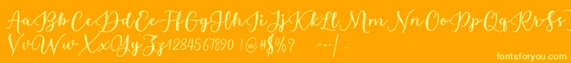 Estafet Letter Script Font – Yellow Fonts on Orange Background
