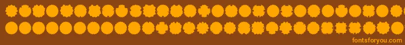 フォントOvul2me – オレンジ色の文字が茶色の背景にあります。