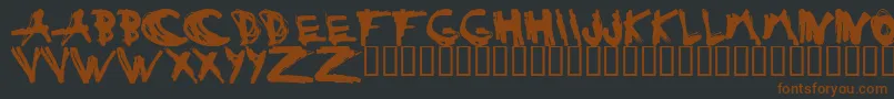 ESTUH   -fontti – ruskeat fontit mustalla taustalla