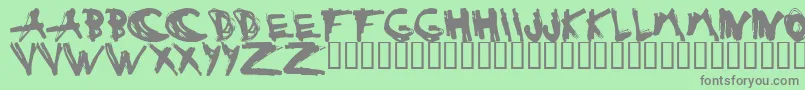 ESTUH   -fontti – harmaat kirjasimet vihreällä taustalla