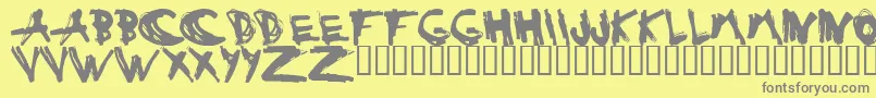 フォントESTUH    – 黄色の背景に灰色の文字