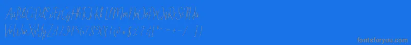 EthelyneItalic-Schriftart – Graue Schriften auf blauem Hintergrund