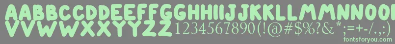 ETIENNE Font – Green Fonts on Gray Background