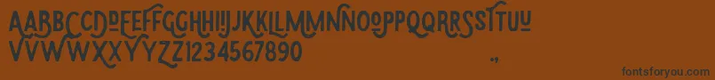 Eudora-Schriftart – Schwarze Schriften auf braunem Hintergrund