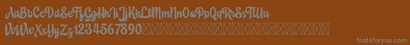 Eustachio demo version-fontti – harmaat kirjasimet ruskealla taustalla