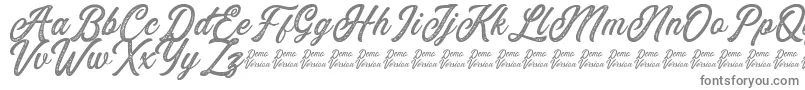 フォントEusthalia Stamped – 白い背景に灰色の文字
