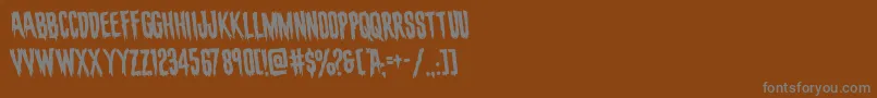 フォントevafangoriarotate – 茶色の背景に灰色の文字