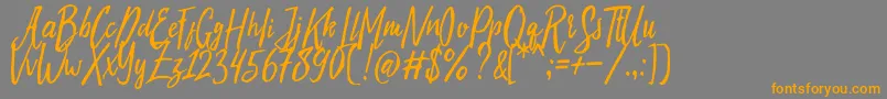 フォントEvelyne Typeface Free Demo – オレンジの文字は灰色の背景にあります。