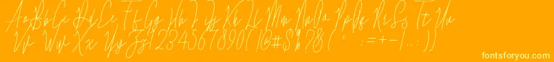 Evergreen Free-Schriftart – Gelbe Schriften auf orangefarbenem Hintergrund