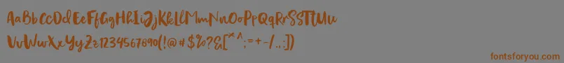 Шрифт Evertone Script – коричневые шрифты на сером фоне