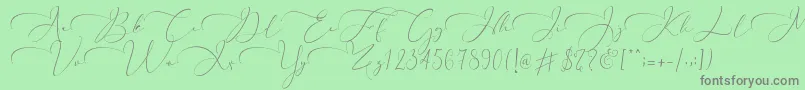 Fonte Everything Calligraphy   – fontes cinzas em um fundo verde