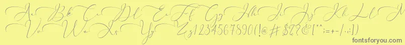 フォントEverything Calligraphy   – 黄色の背景に灰色の文字