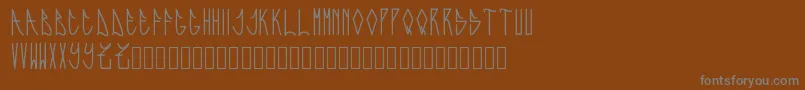 Fonte Expresiva – fontes cinzas em um fundo marrom