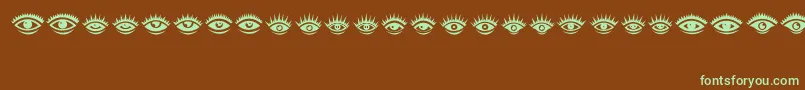 Czcionka Eyez – zielone czcionki na brązowym tle
