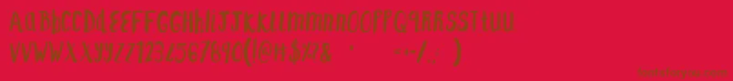 F    SAINT TROPEZ ALT-Schriftart – Braune Schriften auf rotem Hintergrund