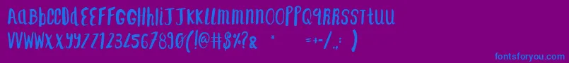 F    SAINT TROPEZ ALT2-Schriftart – Blaue Schriften auf violettem Hintergrund