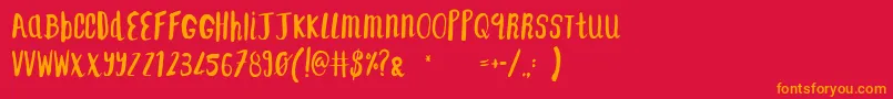 F    SAINT TROPEZ ALT2-Schriftart – Orangefarbene Schriften auf rotem Hintergrund