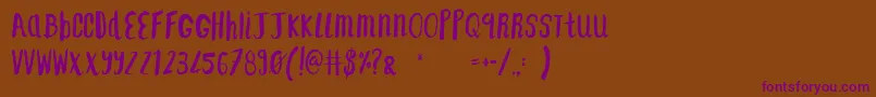 F    SAINT TROPEZ ALT2-Schriftart – Violette Schriften auf braunem Hintergrund