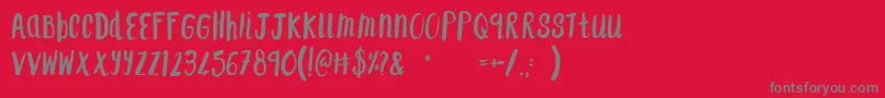 フォントF    SAINT TROPEZ – 赤い背景に灰色の文字