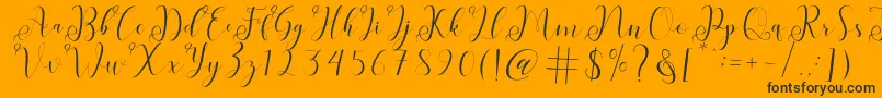 fabitha-Schriftart – Schwarze Schriften auf orangefarbenem Hintergrund