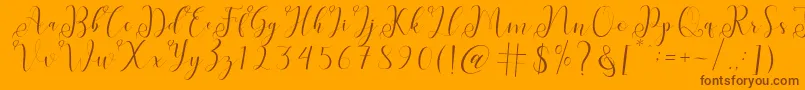 fabitha-Schriftart – Braune Schriften auf orangefarbenem Hintergrund