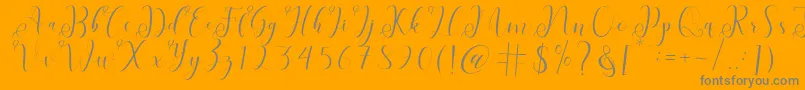 fabitha-Schriftart – Graue Schriften auf orangefarbenem Hintergrund