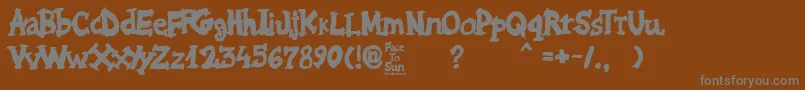 Face to Sun-fontti – harmaat kirjasimet ruskealla taustalla