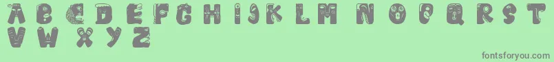 Facelook Font – Gray Fonts on Green Background