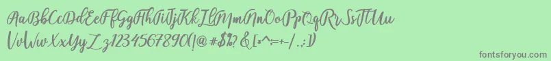 フォントfadelya – 緑の背景に灰色の文字