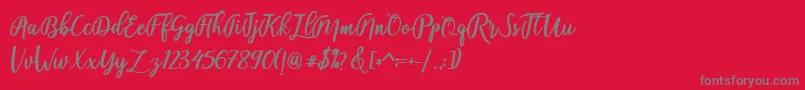 fadelya-Schriftart – Graue Schriften auf rotem Hintergrund