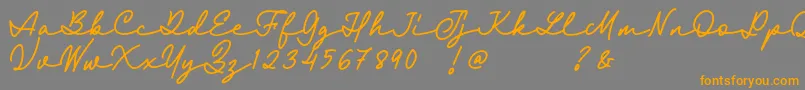 Czcionka Fairyland Demo Font – pomarańczowe czcionki na szarym tle