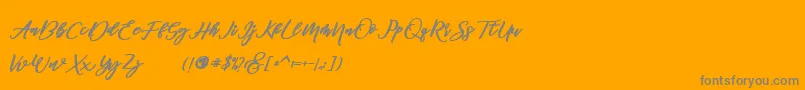 famous -Schriftart – Graue Schriften auf orangefarbenem Hintergrund