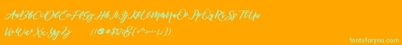 famous -Schriftart – Grüne Schriften auf orangefarbenem Hintergrund