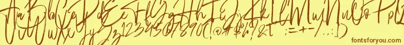 フォントFantastico – 茶色の文字が黄色の背景にあります。
