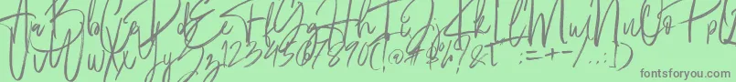 Fantastico-Schriftart – Graue Schriften auf grünem Hintergrund