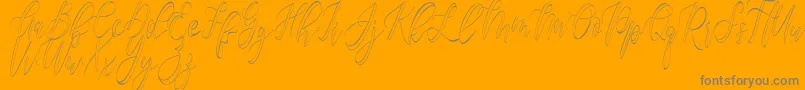 Lisätietoja Fantasy Hollow -fontista Fantasy Hollow -fontti – harmaat kirjasimet oranssilla taustalla