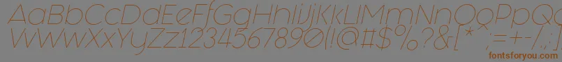 フォントFashion Fetish Light Italic – 茶色の文字が灰色の背景にあります。