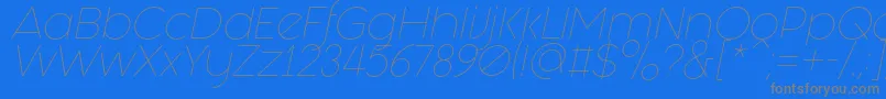 Czcionka Fashion Fetish Light Italic – szare czcionki na niebieskim tle