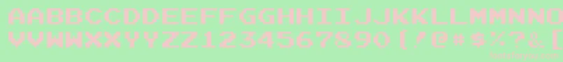 JoystixMonospace-Schriftart – Rosa Schriften auf grünem Hintergrund