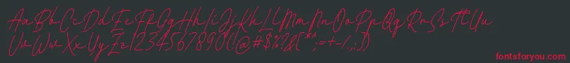 Fattana Regular Italic Font by 7NTypes Font – Red Fonts on Black Background